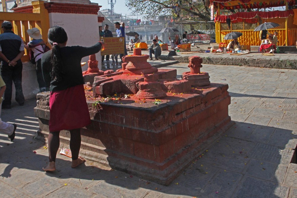 Reclining Vishnu stone statue resting in the sacred pond at Budhanilkantha Temple, Kathmandu, Nepal